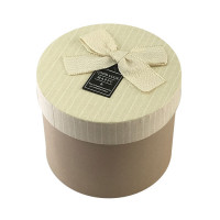 Подарочная упаковка круглая с бантом, цвет светло-коричневый. Подарочная упаковка круглая с бантом, цвет светло-коричневый.